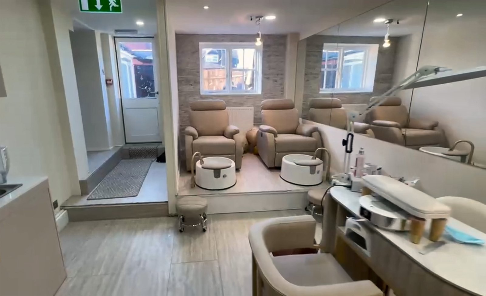Pedicure thrones beneath the back windows
